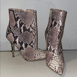 Women’s snakeskin heeled bootie